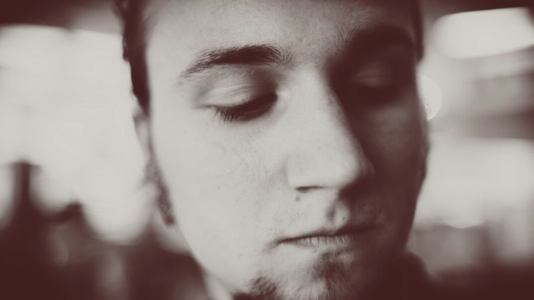 Portrait of a bearded man with a calm expression